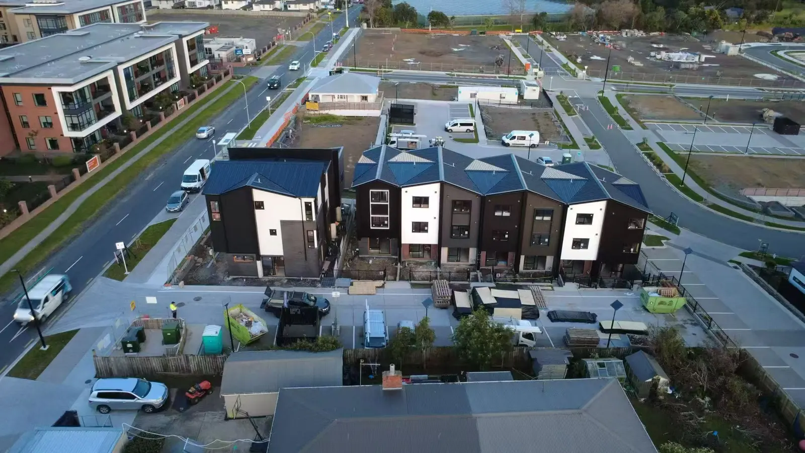 Multi-storey townhouse exteriors with roofing and cladding installed